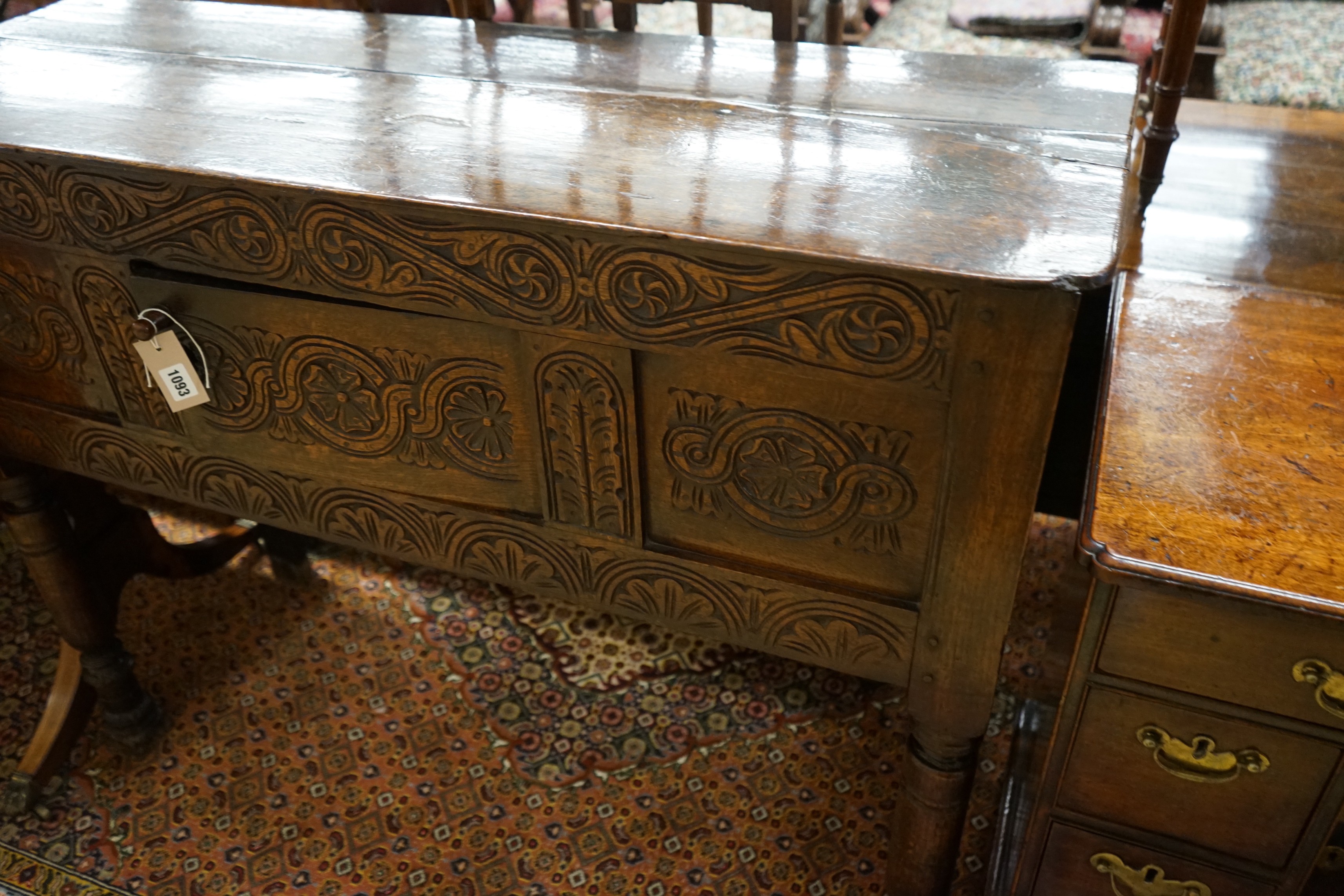 An 18th century and later carved oak cabinet on stand, width 118cm, depth 42cm, height 96cm